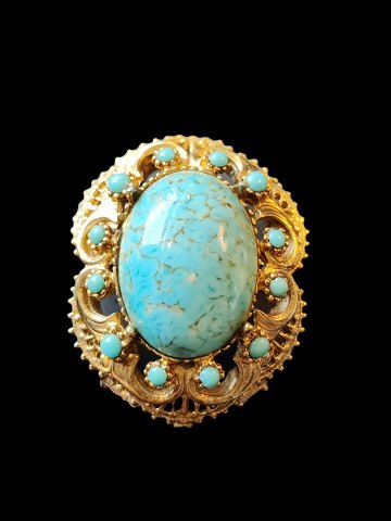 gilded silver brooch with turquoise